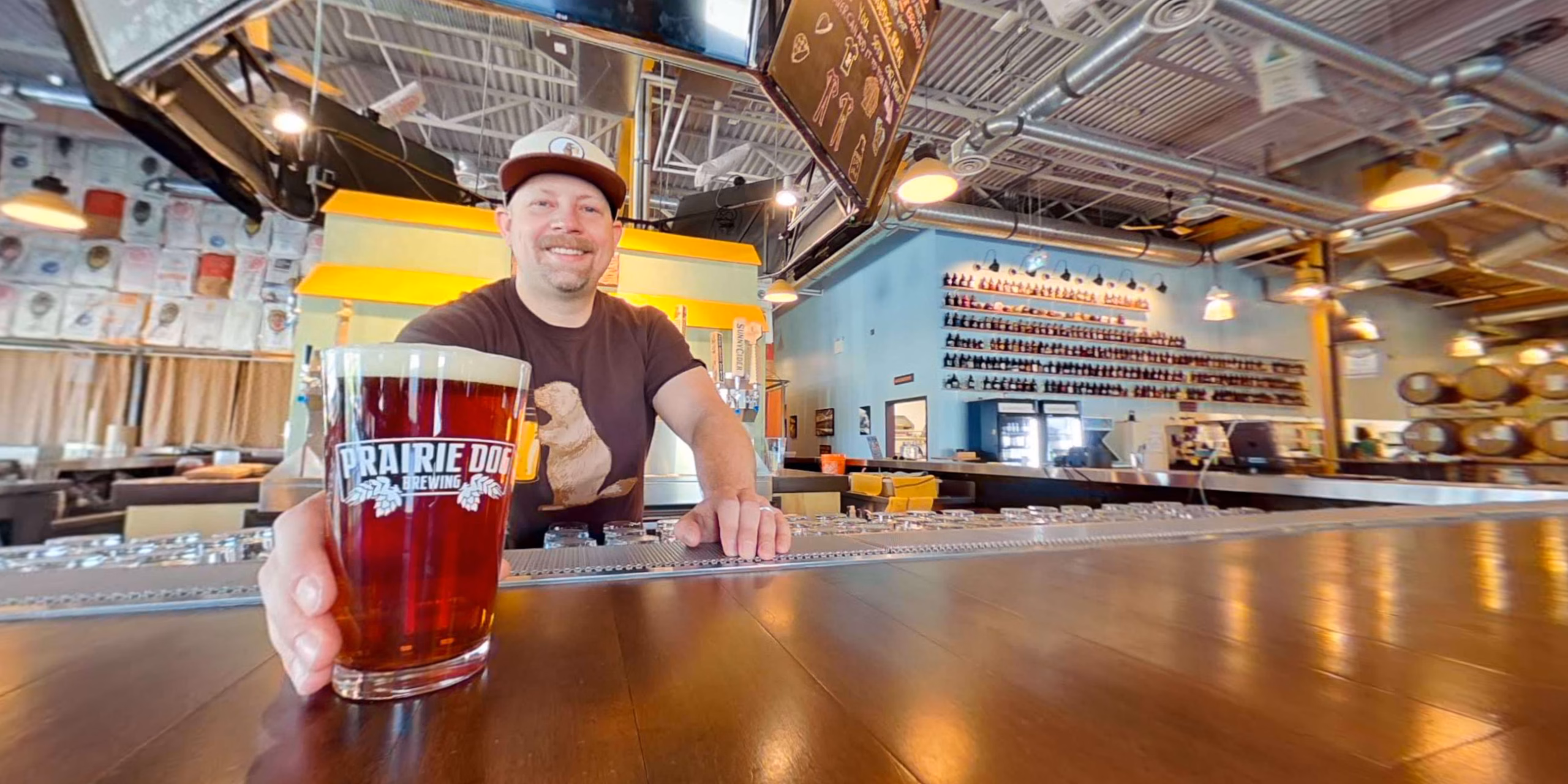 Prairie Dog Brewing co-founder Gerad Coles serves a pint of beer at Prairie Dog Brewing's 58th avenue Calgary brewpub.