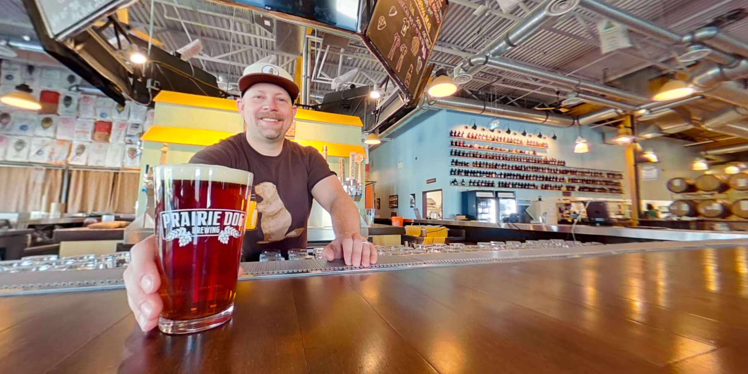 Prairie Dog Brewing co-founder Gerad Coles serves a pint of beer at Prairie Dog Brewing's 58th avenue Calgary brewpub.