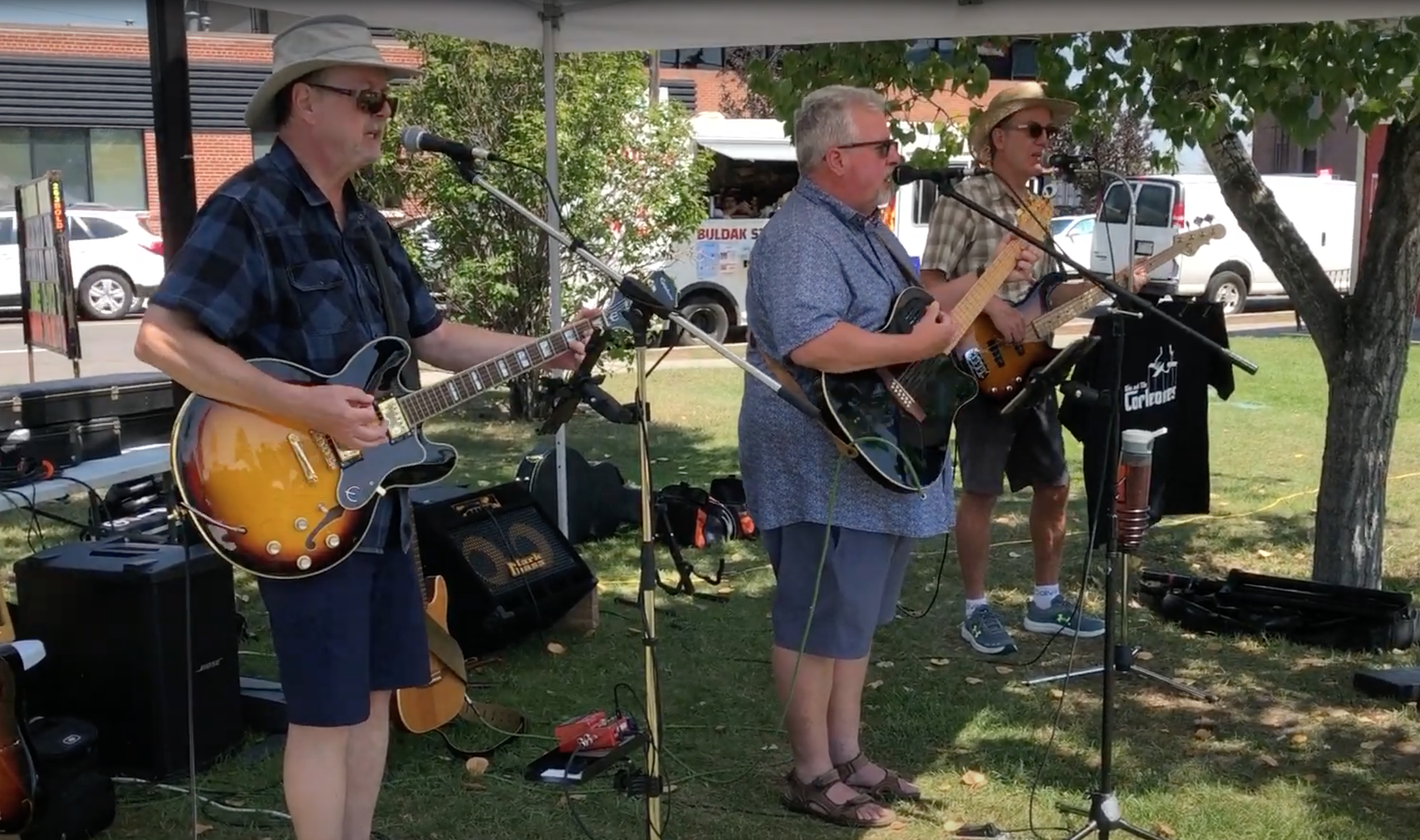 Calgary 3-piece band Don & The Corleones play outdoors.