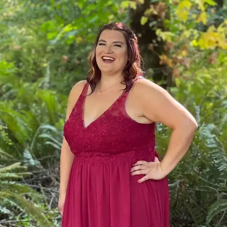 Prairie Dog Brewing co-founder and Director of Marketing & Public Relations, Laura Coles, stands in a bridesmaid outfit.