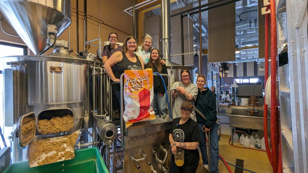 2024's Pink Boots Collaboration Brew at Prairie Dog, with (left to right) Jen Rogers of Wild Winds Brewery, Laura Coles of Prairie Dog Brewing, Allie and her team from Rising Tides Taproom, and Christina Owczarek of X'hAle Brewing.