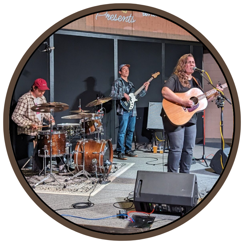 Musicians performing on stage at Prairie Dog Brewing.